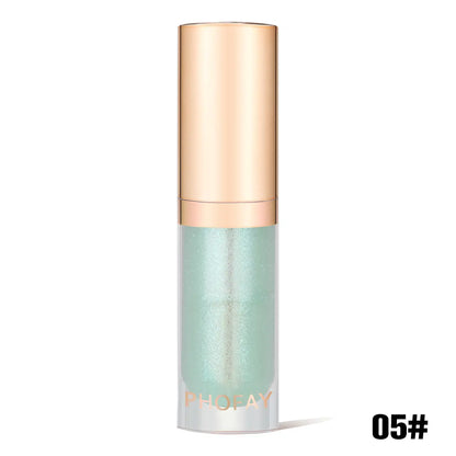 lip oil bottle with gold cap and light green body on a white background