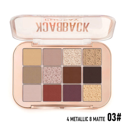 Makeup palette with various shades of eyeshadow in metallic and matte finishes, branded.