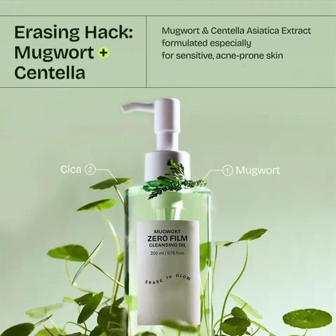 Bottle of Mugwort Zero Film Cleansing Oil with mugwort leaves on a green background